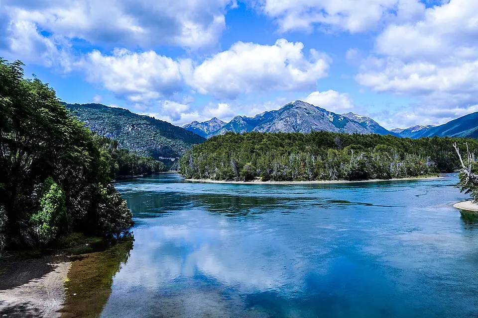 The interconnected lake system of Los Alerces National Park reflecting the Andean peaks